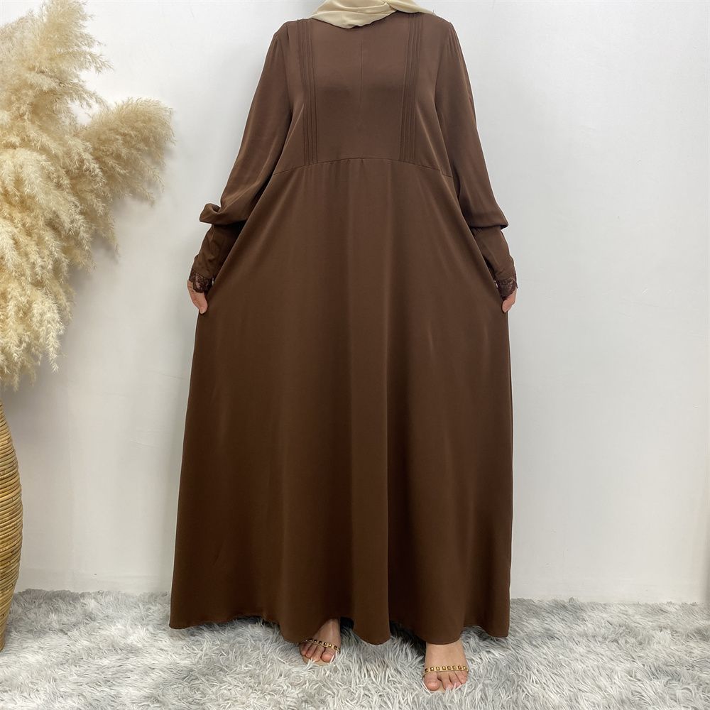 A simple and luxurious Muslim Middle Eastern woman's dress with lace zippers, an Islamic Turkish pleated front zipper, and an Arab Turkish cardigan robe