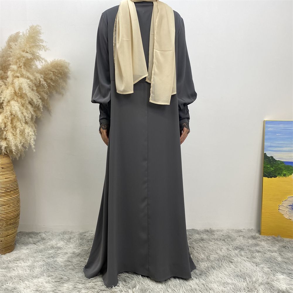 A simple and luxurious Muslim Middle Eastern woman's dress with lace zippers, an Islamic Turkish pleated front zipper, and an Arab Turkish cardigan robe