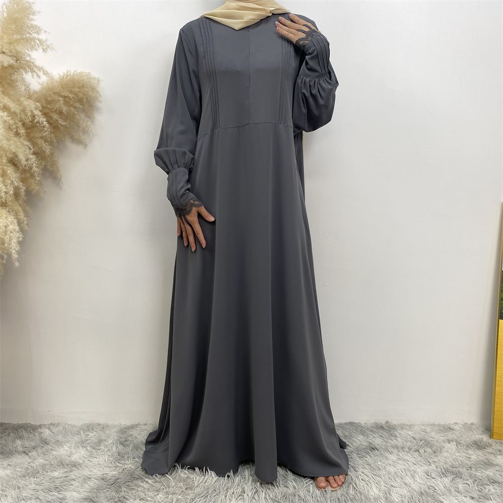A simple and luxurious Muslim Middle Eastern woman's dress with lace zippers, an Islamic Turkish pleated front zipper, and an Arab Turkish cardigan robe