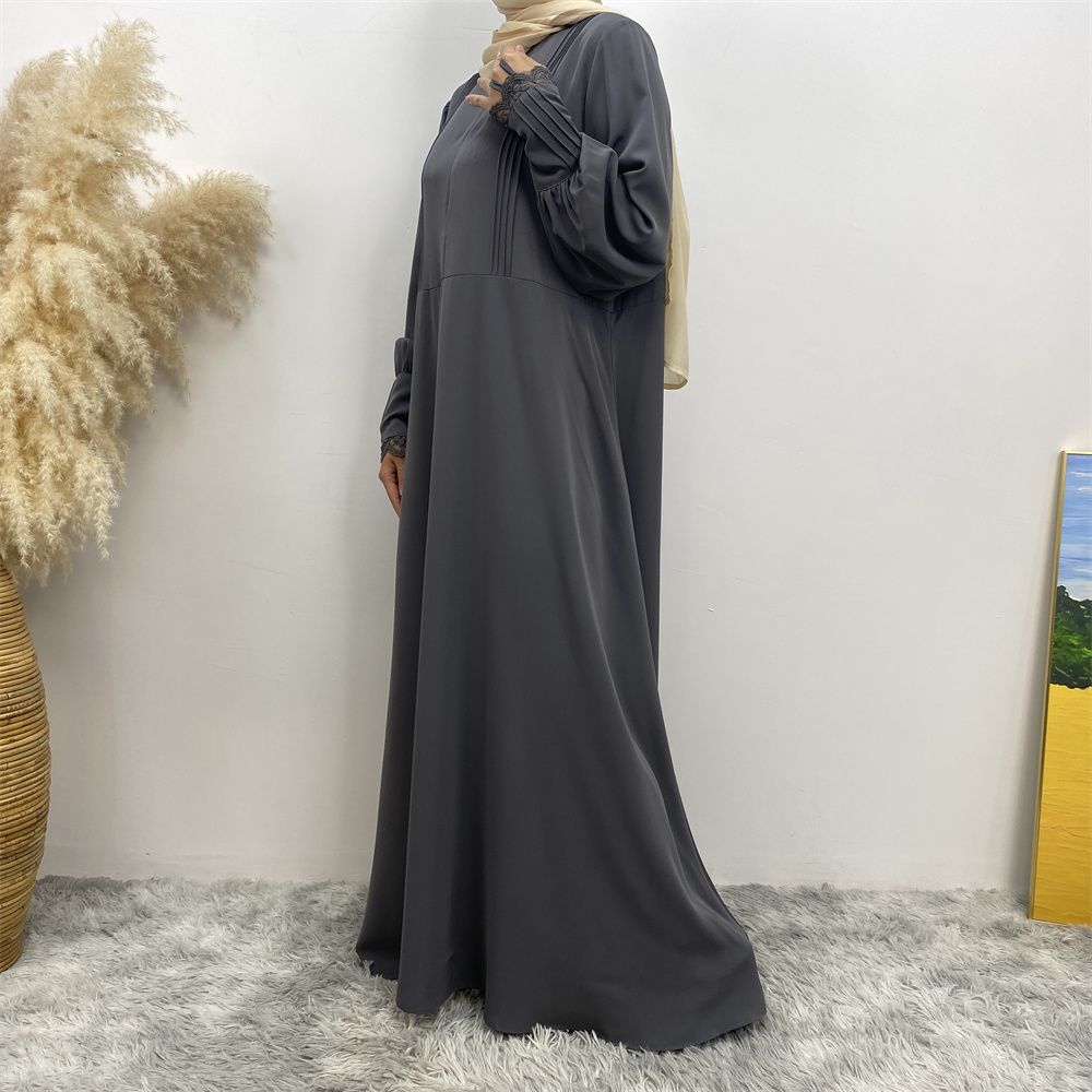 A simple and luxurious Muslim Middle Eastern woman's dress with lace zippers, an Islamic Turkish pleated front zipper, and an Arab Turkish cardigan robe