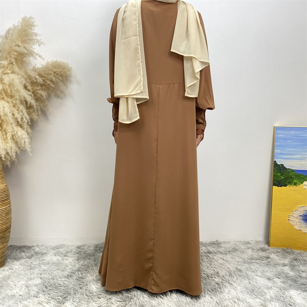 A simple and luxurious Muslim Middle Eastern woman's dress with lace zippers, an Islamic Turkish pleated front zipper, and an Arab Turkish cardigan robe