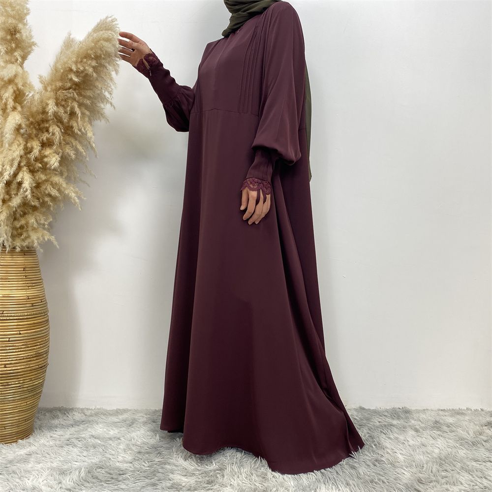 A simple and luxurious Muslim Middle Eastern woman's dress with lace zippers, an Islamic Turkish pleated front zipper, and an Arab Turkish cardigan robe