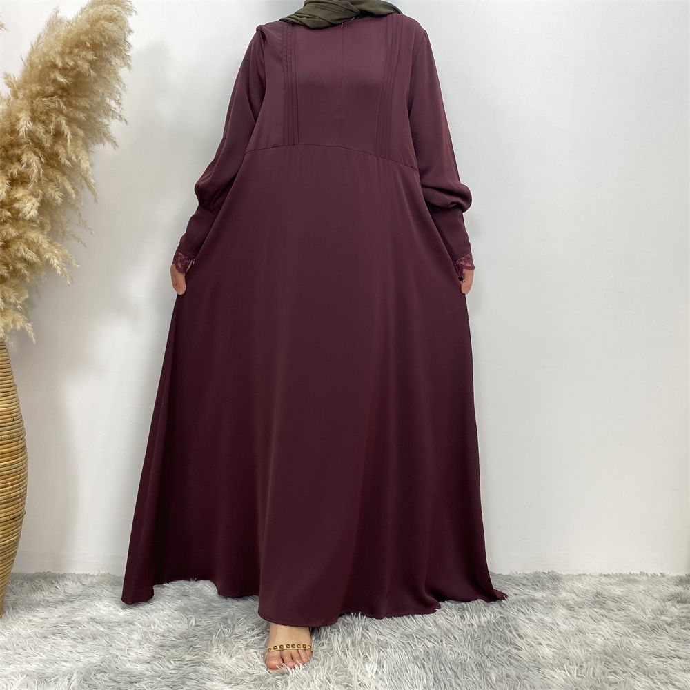 A simple and luxurious Muslim Middle Eastern woman's dress with lace zippers, an Islamic Turkish pleated front zipper, and an Arab Turkish cardigan robe