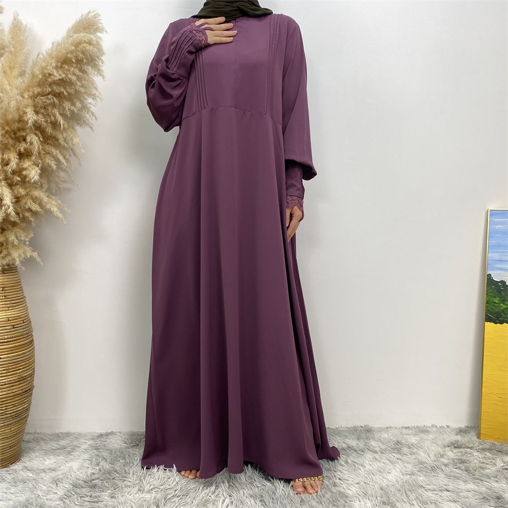A simple and luxurious Muslim Middle Eastern woman's dress with lace zippers, an Islamic Turkish pleated front zipper, and an Arab Turkish cardigan robe