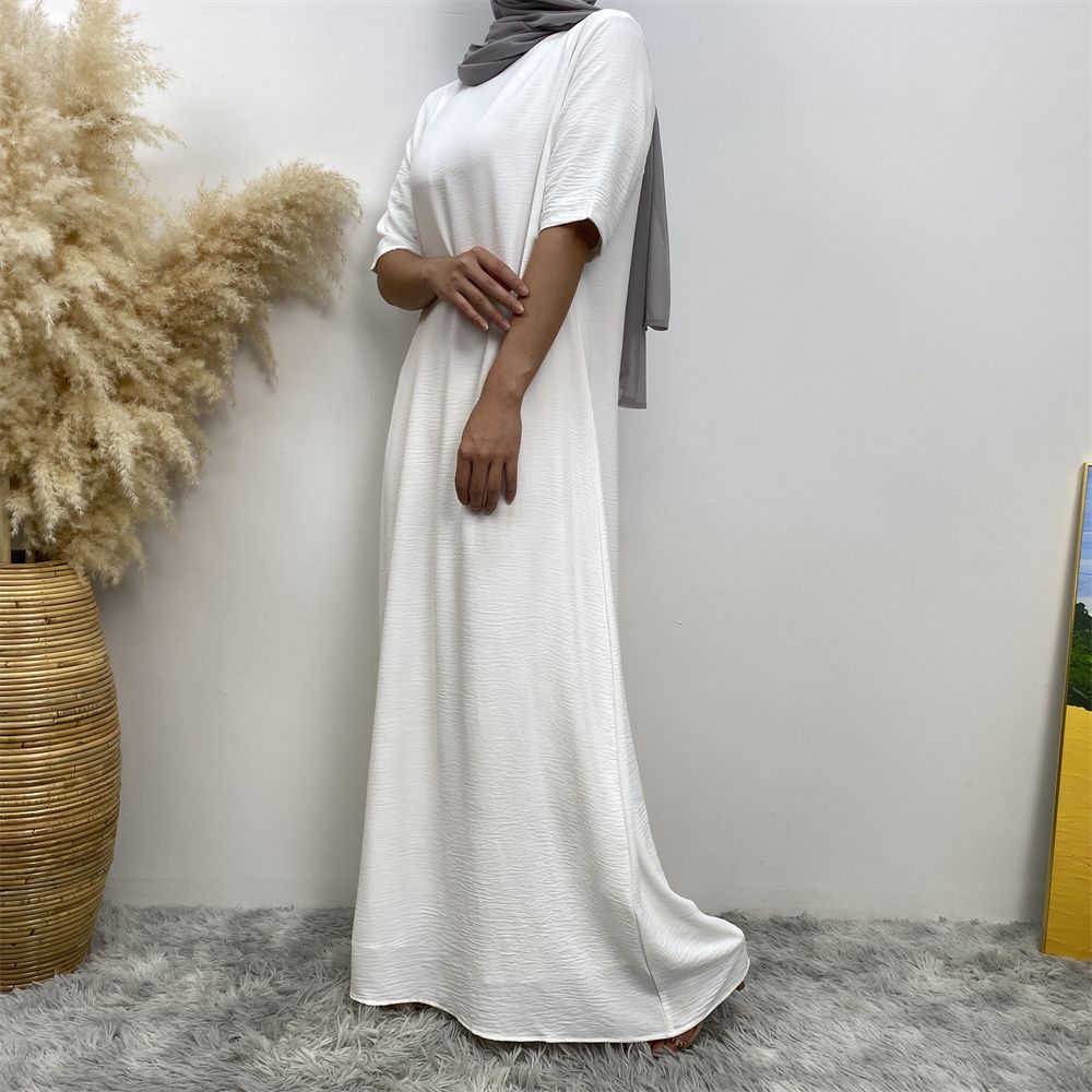 Muslim fashion: A simple, plain-colored mid-sleeved dress in Dubai, Middle East, and elegant women's clothing from Africa, Arabia and Turkey