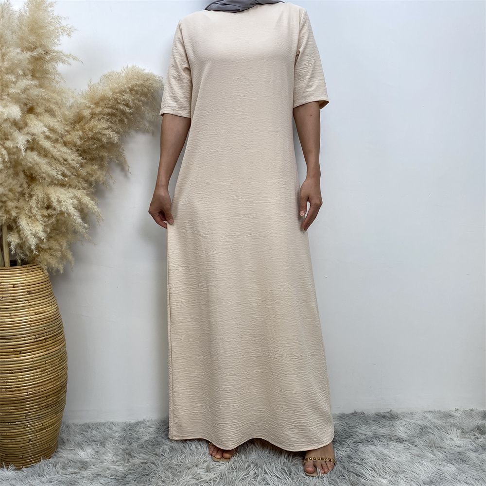 Muslim fashion: A simple, plain-colored mid-sleeved dress in Dubai, Middle East, and elegant women's clothing from Africa, Arabia and Turkey