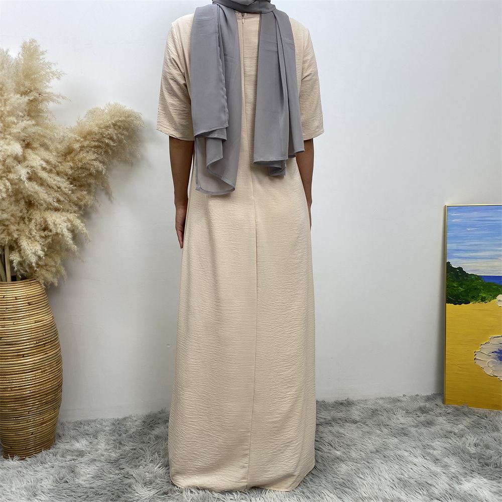 Muslim fashion: A simple, plain-colored mid-sleeved dress in Dubai, Middle East, and elegant women's clothing from Africa, Arabia and Turkey