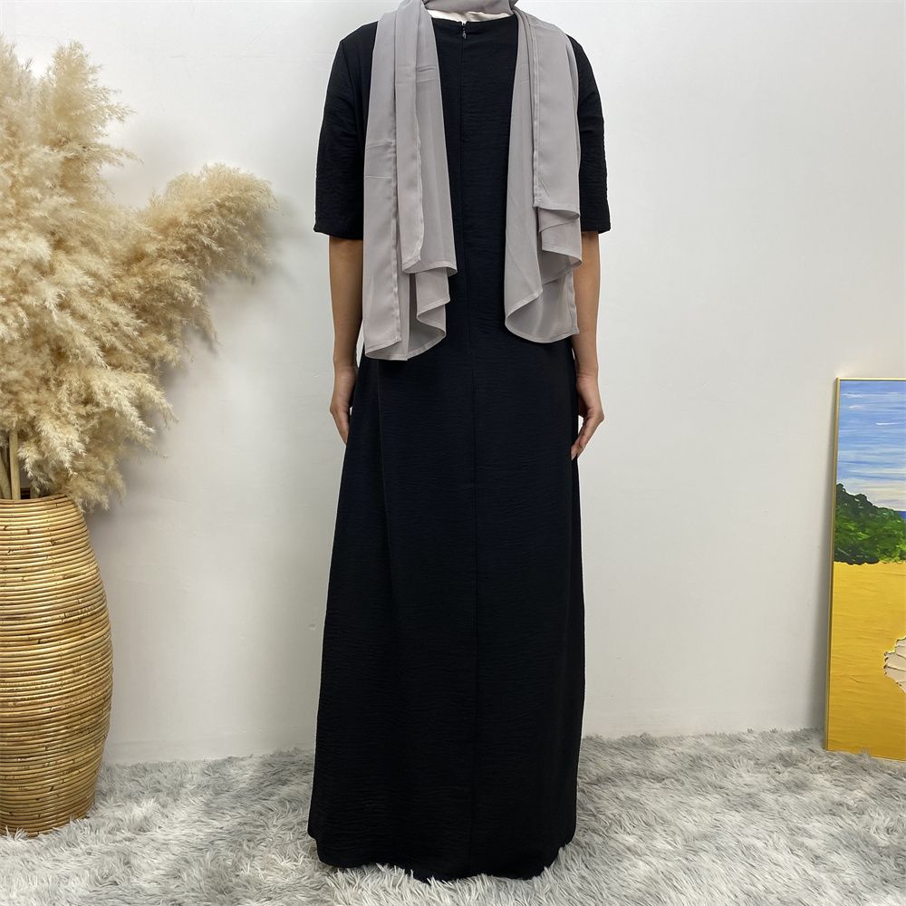 Muslim fashion: A simple, plain-colored mid-sleeved dress in Dubai, Middle East, and elegant women's clothing from Africa, Arabia and Turkey