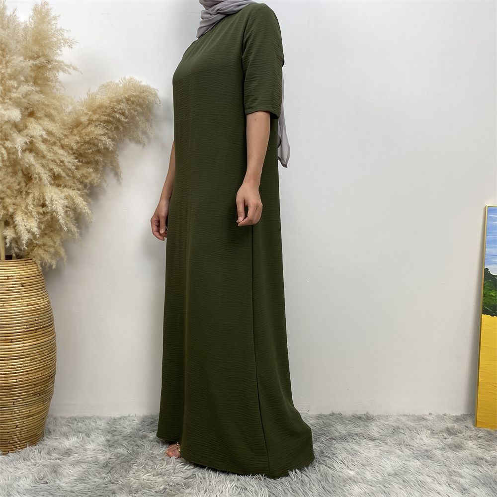Muslim fashion: A simple, plain-colored mid-sleeved dress in Dubai, Middle East, and elegant women's clothing from Africa, Arabia and Turkey