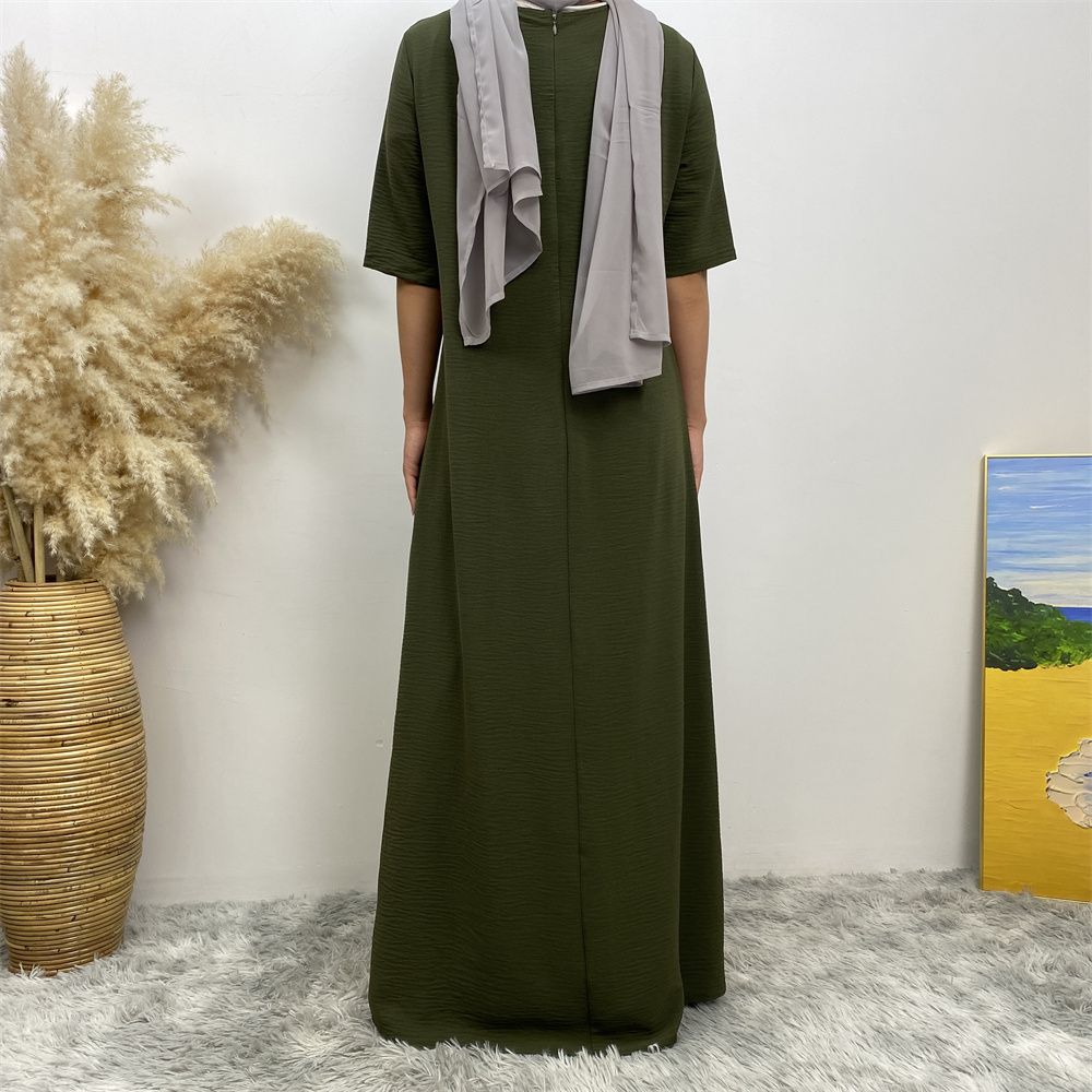 Muslim fashion: A simple, plain-colored mid-sleeved dress in Dubai, Middle East, and elegant women's clothing from Africa, Arabia and Turkey