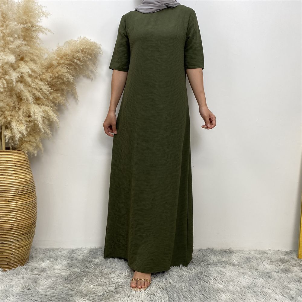 Muslim fashion: A simple, plain-colored mid-sleeved dress in Dubai, Middle East, and elegant women's clothing from Africa, Arabia and Turkey
