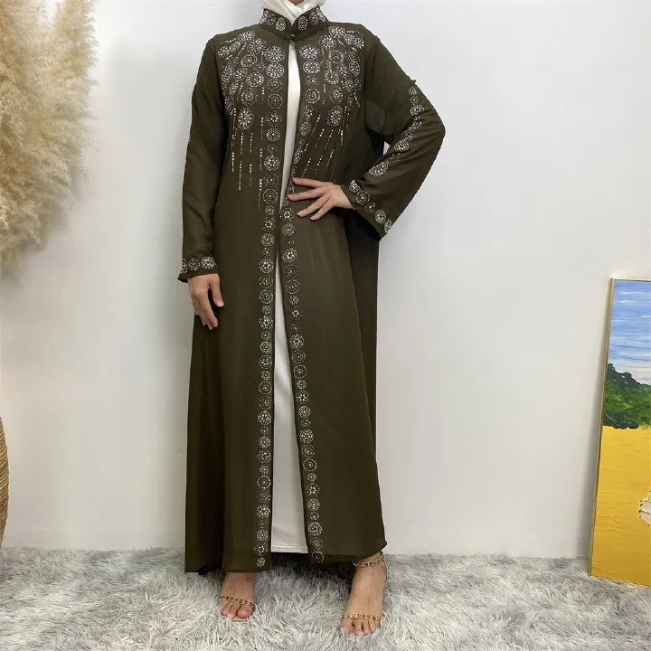 A fashionable Middle Eastern Muslim cardigan dress with hot diamonds is selling well in Dubai, Morocco