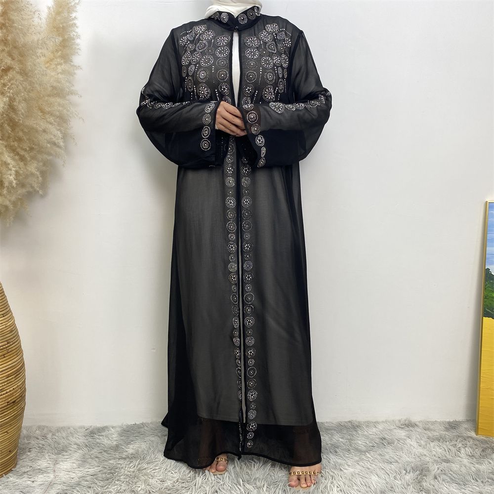 A fashionable Middle Eastern Muslim cardigan dress with hot diamonds is selling well in Dubai, Morocco