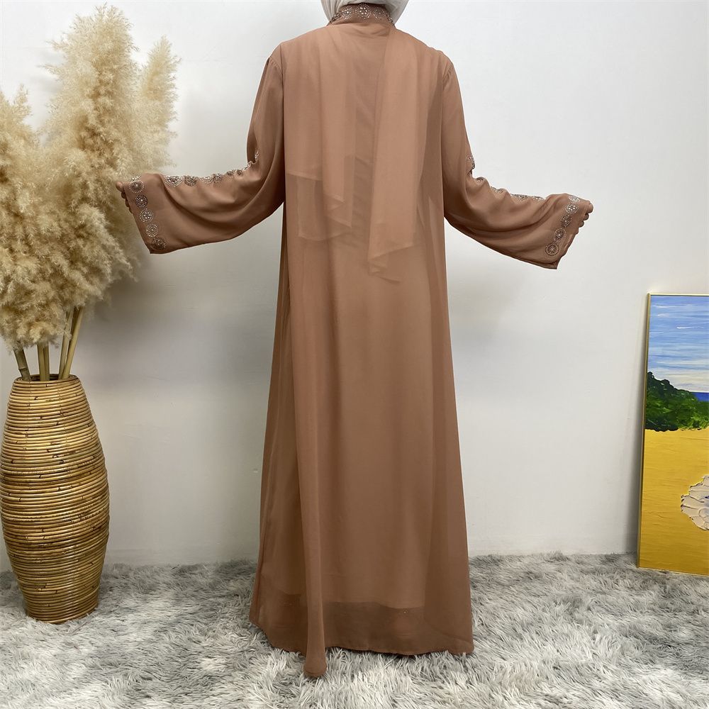A fashionable Middle Eastern Muslim cardigan dress with hot diamonds is selling well in Dubai, Morocco