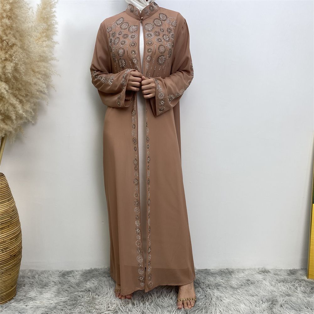 A fashionable Middle Eastern Muslim cardigan dress with hot diamonds is selling well in Dubai, Morocco