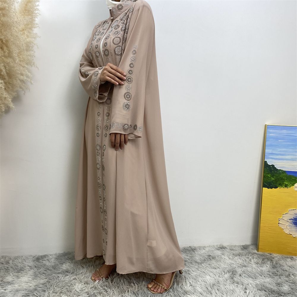 A fashionable Middle Eastern Muslim cardigan dress with hot diamonds is selling well in Dubai, Morocco