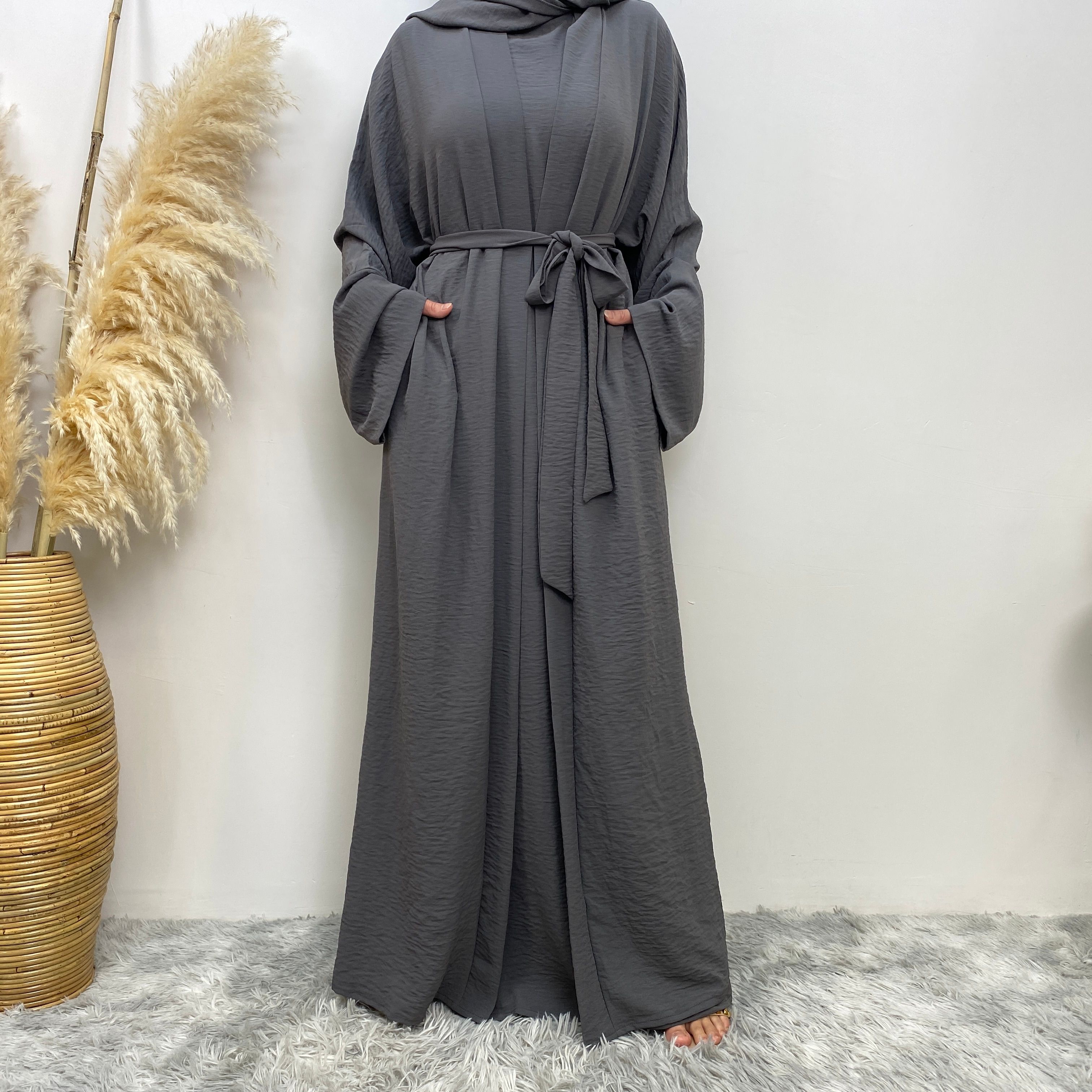 Middle Eastern simple and fashionable Muslim suit Abaya sleeveless dress with pockets for women cardigan dress