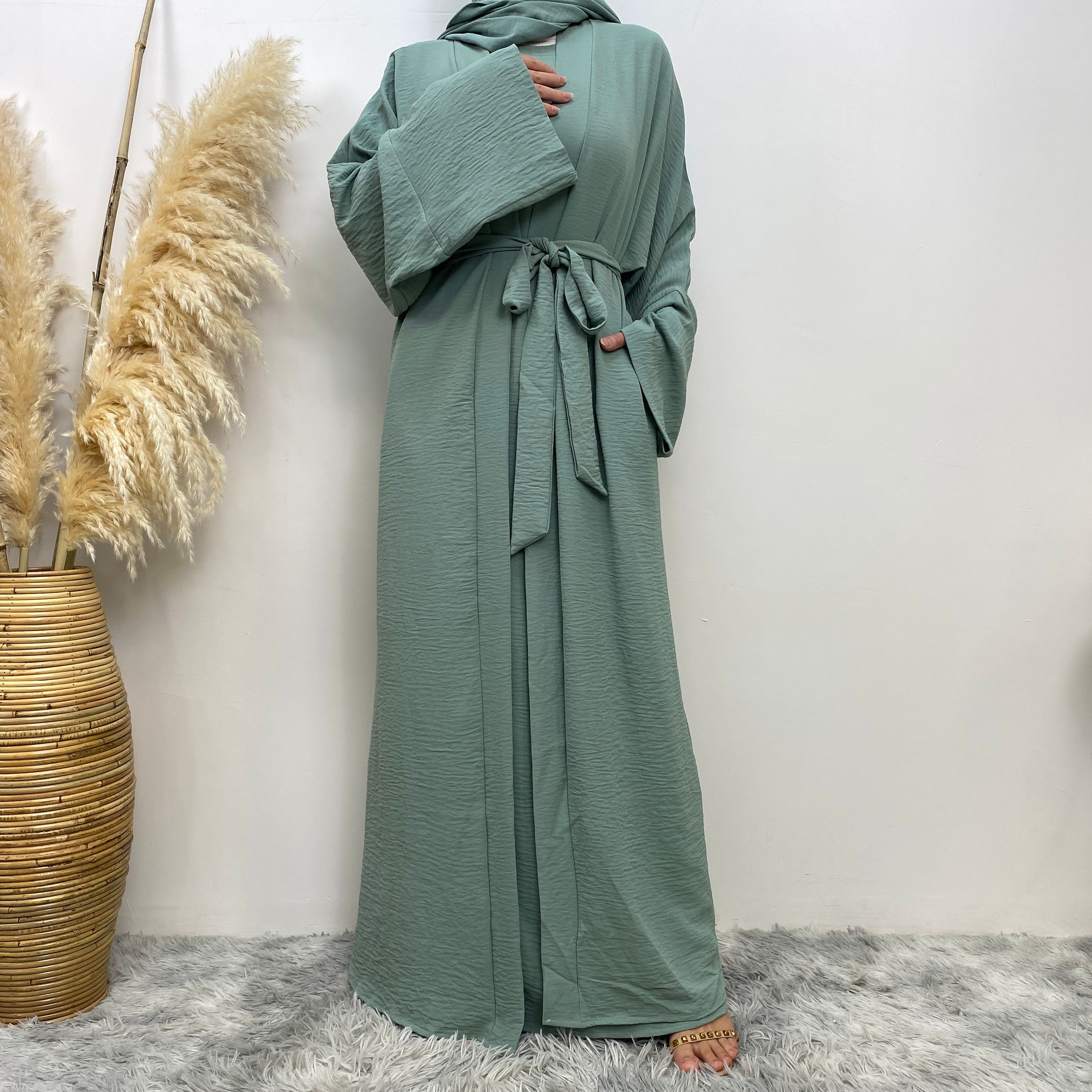Middle Eastern simple and fashionable Muslim suit Abaya sleeveless dress with pockets for women cardigan dress