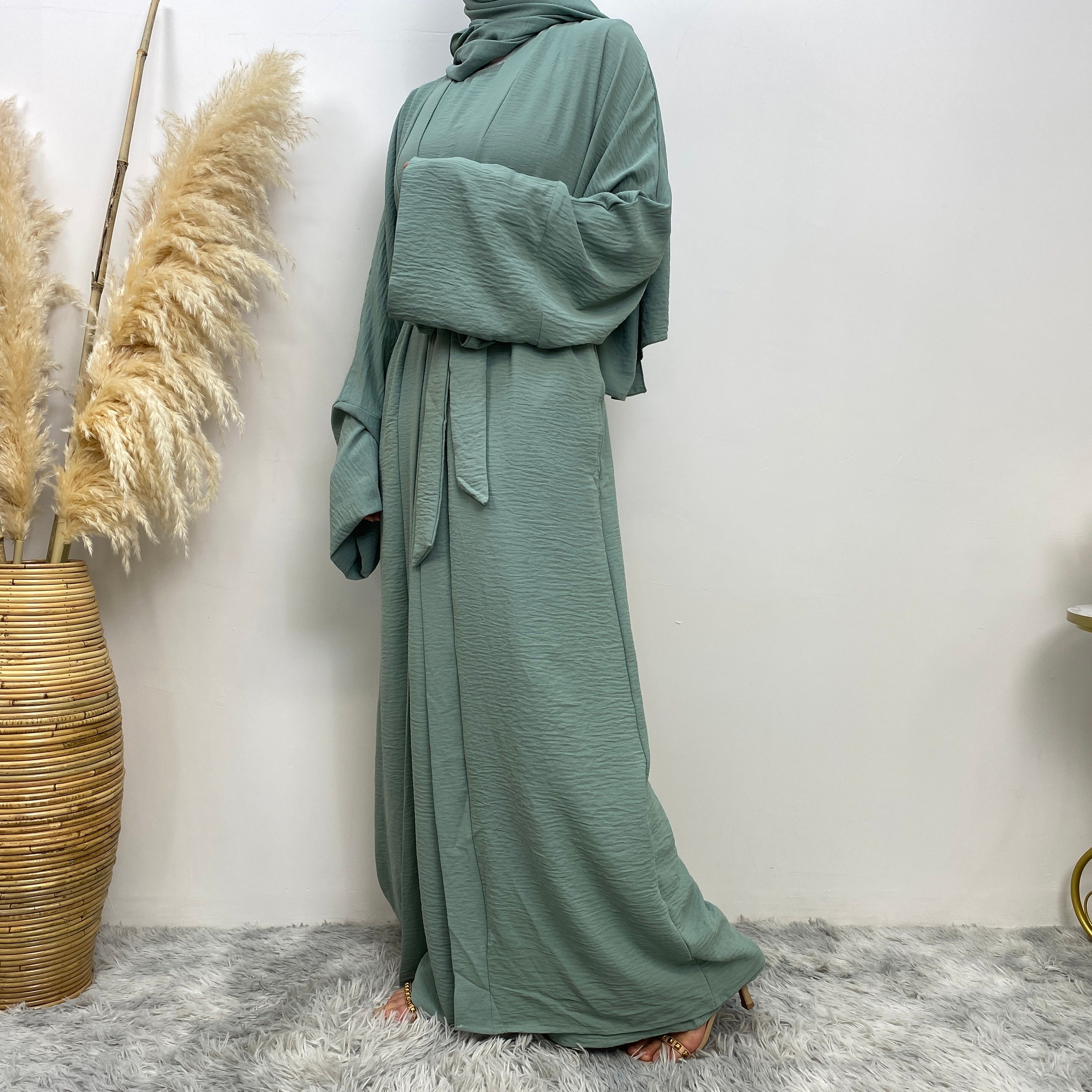 Middle Eastern simple and fashionable Muslim suit Abaya sleeveless dress with pockets for women cardigan dress