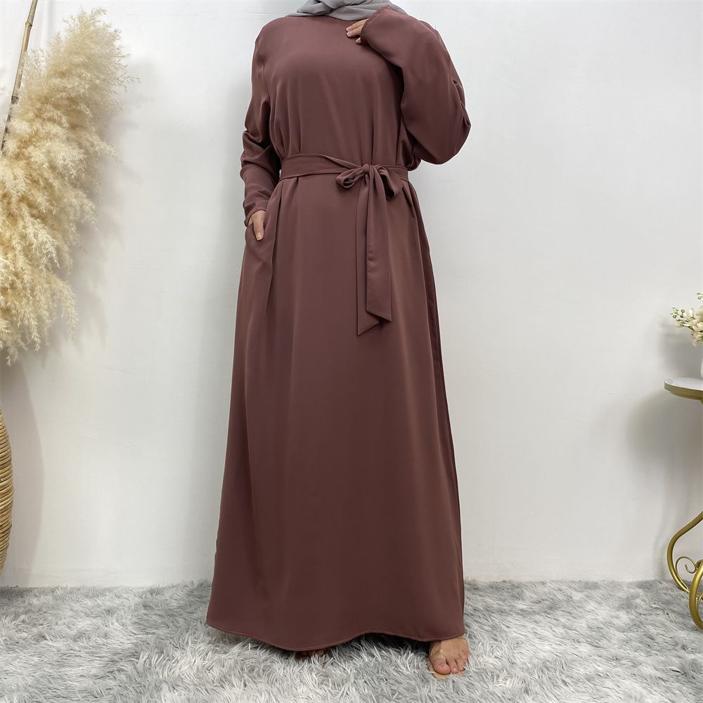 New Middle Eastern Muslim fashion, Dubai, Turkey and Africa's best-selling solid color tie and pocket Muslim dress