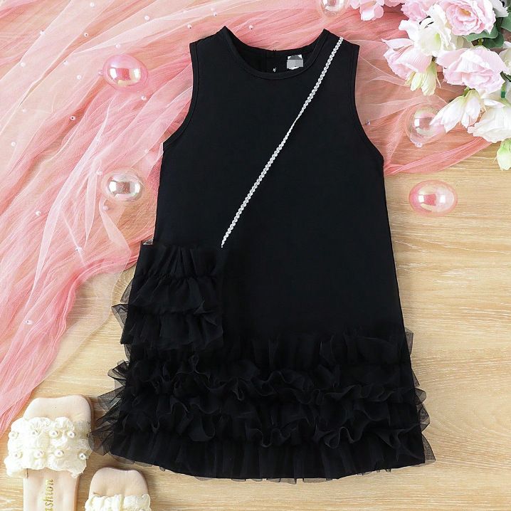 Summer dress for girls in children's clothing. It's a sleeveless A-line princess dress with a tiered cake-style tulle skirt, and it comes with a bag