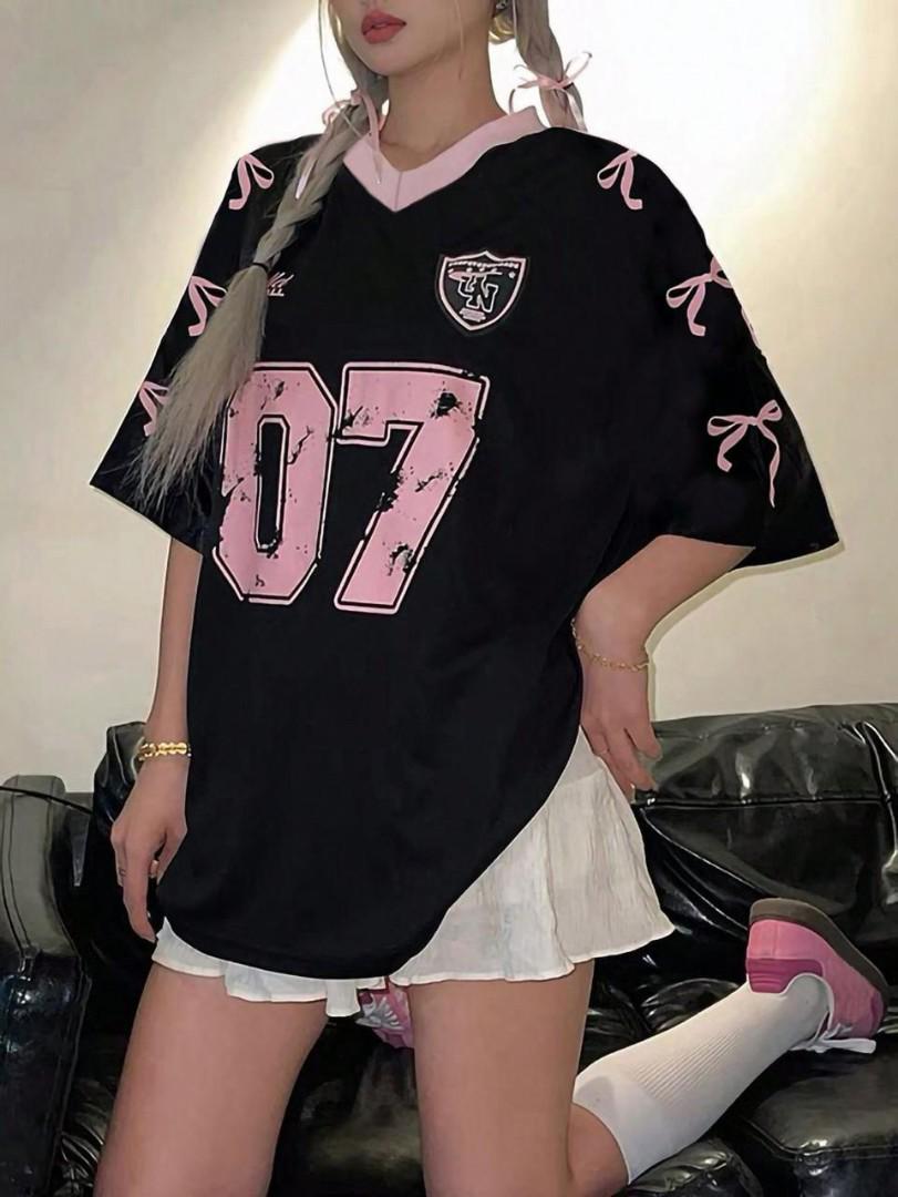 Trendy Oversized 07 Jersey T-Shirt – Casual Streetwear Top with Lace Hem Style, Graphic Print & Ribbon Sleeve Detail. Available in Pink, Black, White, Red & Blue for Fashionable Everyday Wear