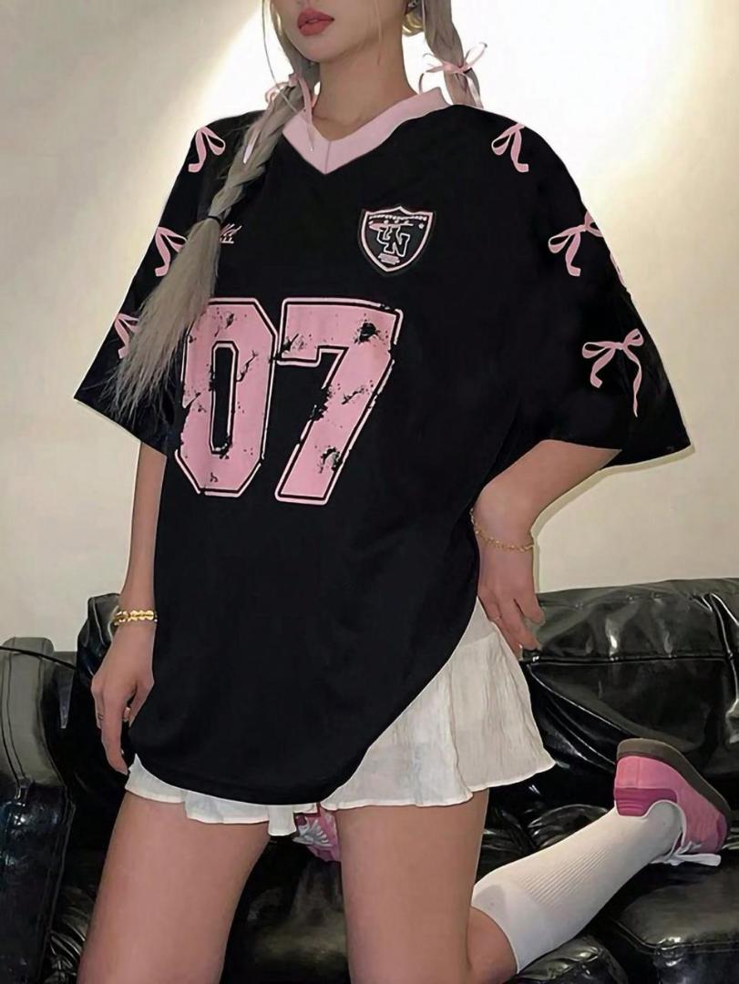 Trendy Oversized 07 Jersey T-Shirt – Casual Streetwear Top with Lace Hem Style, Graphic Print & Ribbon Sleeve Detail. Available in Pink, Black, White, Red & Blue for Fashionable Everyday Wear