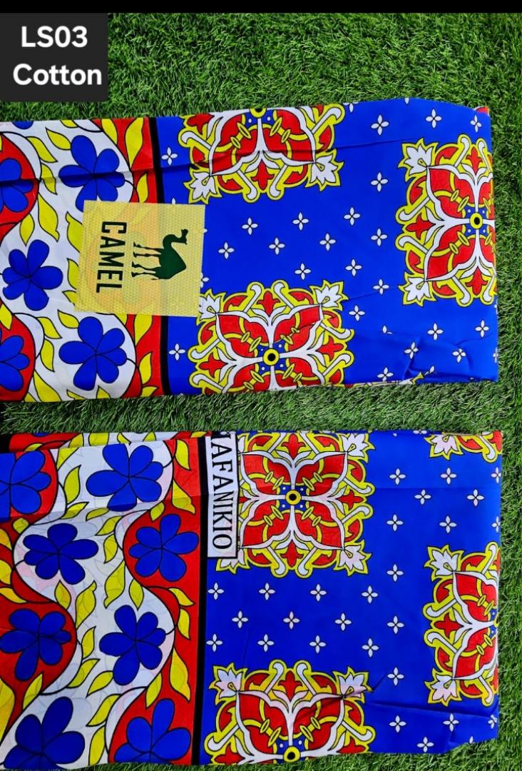 Vibrant LS03 Cotton Kitenge – Premium quality 100% cotton African fabric with bold blue, red, and yellow floral patterns. Perfect for dresses, skirts, shirts, and crafts. Soft, durable, and eye-catchi