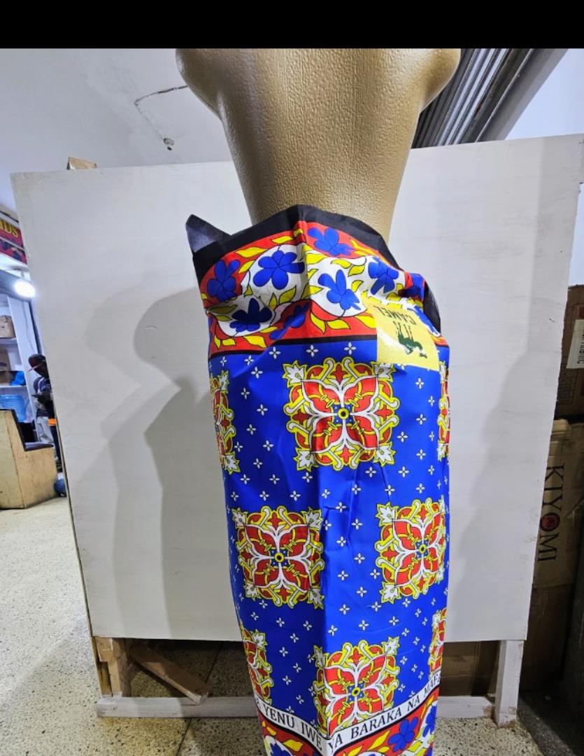 Vibrant LS03 Cotton Kitenge – Premium quality 100% cotton African fabric with bold blue, red, and yellow floral patterns. Perfect for dresses, skirts, shirts, and crafts. Soft, durable, and eye-catchi