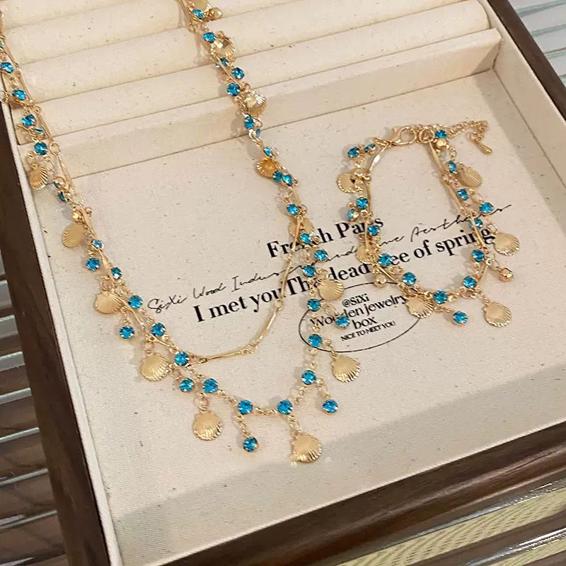 Jewellery Bohemian Ocean Shell Layered Necklace with Blue Crystals – Urembo wa Bahari Jewelry, Gold-Toned Statement Piece for Beach & Party, Unique Gift for Fashion Enthusiasts shell bracelet ocean