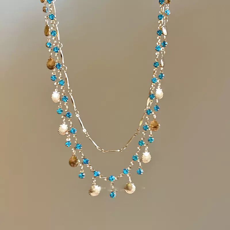 Jewellery Bohemian Ocean Shell Layered Necklace with Blue Crystals – Urembo wa Bahari Jewelry, Gold-Toned Statement Piece for Beach & Party, Unique Gift for Fashion Enthusiasts shell bracelet ocean