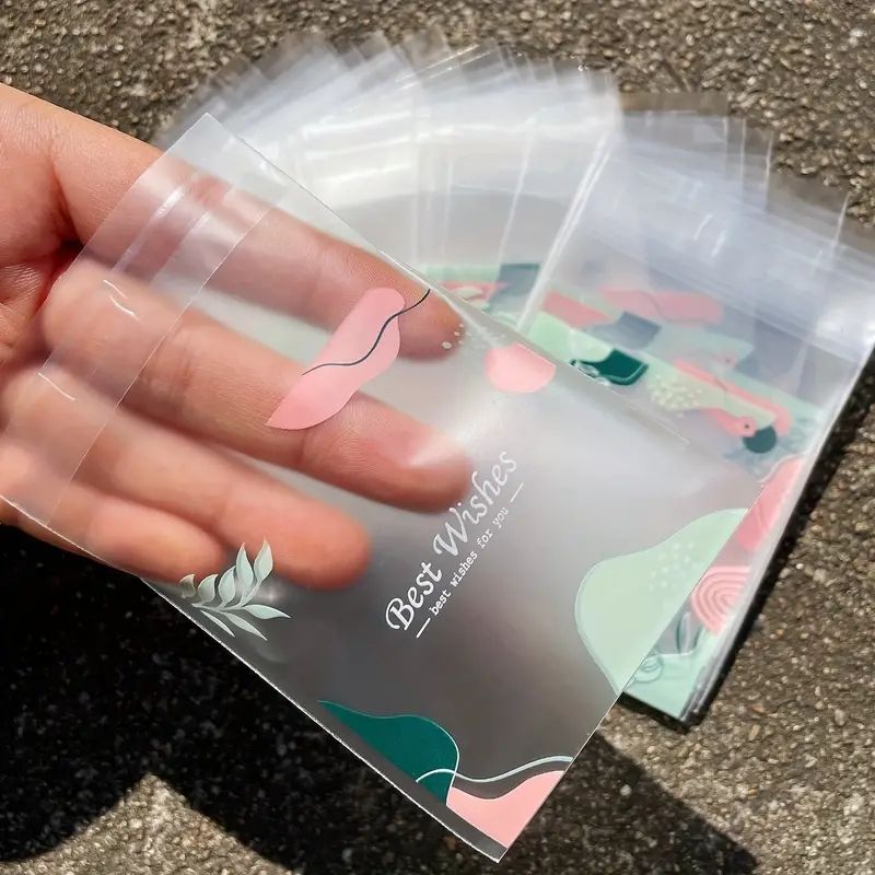 100pcs Thickened Frosted Fern Leaf Printed Gift Bags, Green Leaf Pink Flower Pattern Blessed Words Small Gifts Self-sealing Bag