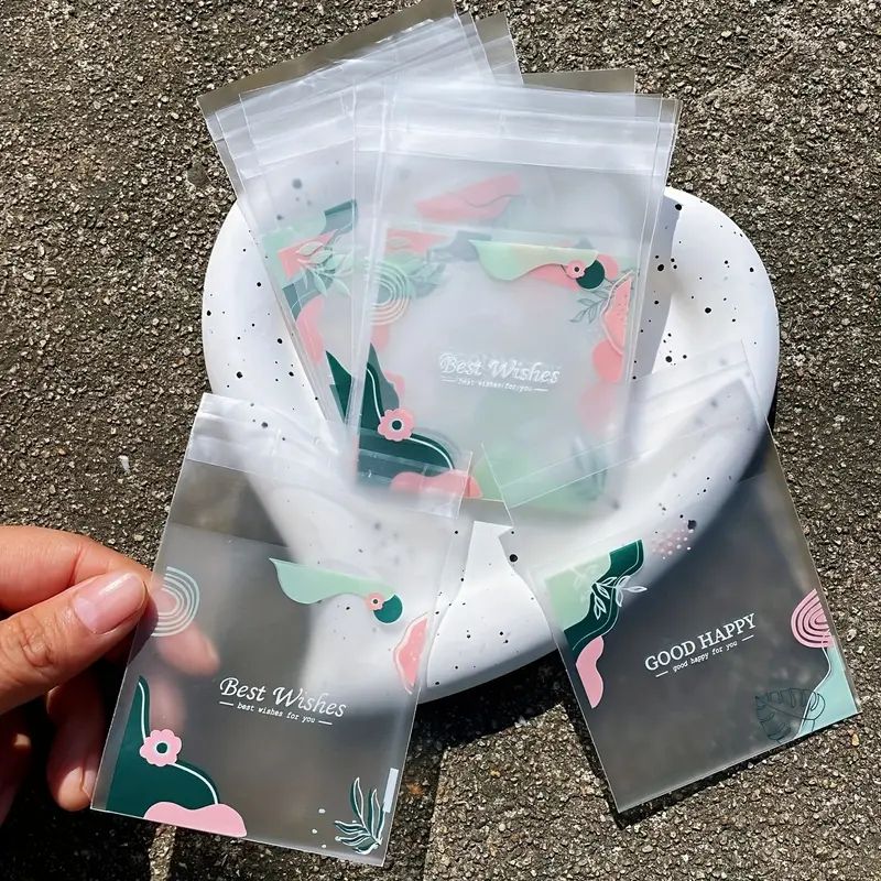100pcs Thickened Frosted Fern Leaf Printed Gift Bags, Green Leaf Pink Flower Pattern Blessed Words Small Gifts Self-sealing Bag