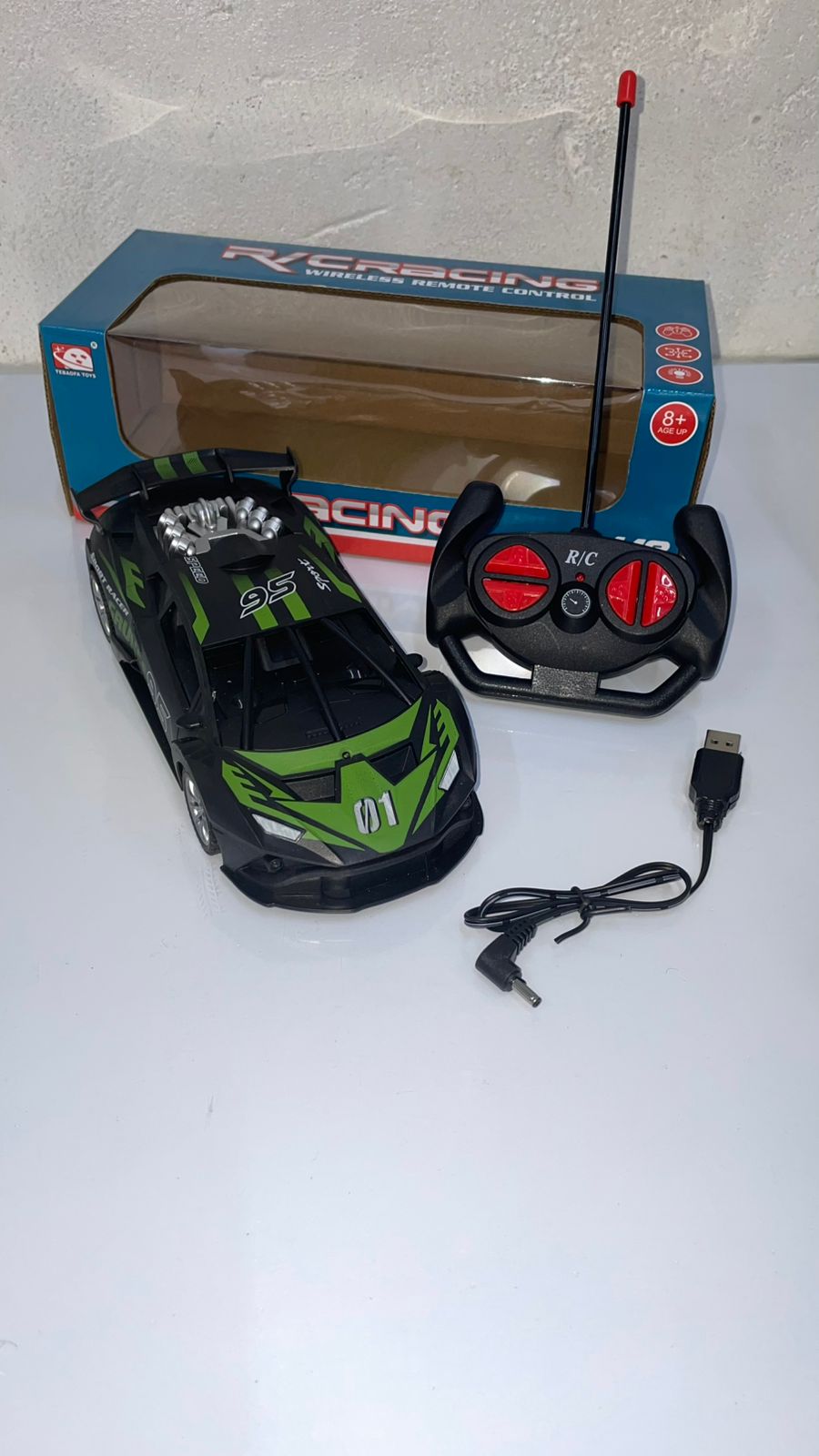 🏎️ RC Racing Car – High-Speed Remote Control Sports Car ⚡🏁 Sleek Design with Green & Black Finish🎮 Easy-to-Use Remote for Smooth Steering & Drifting | 🔋 USB Rechargeable Battery for Long Playtime