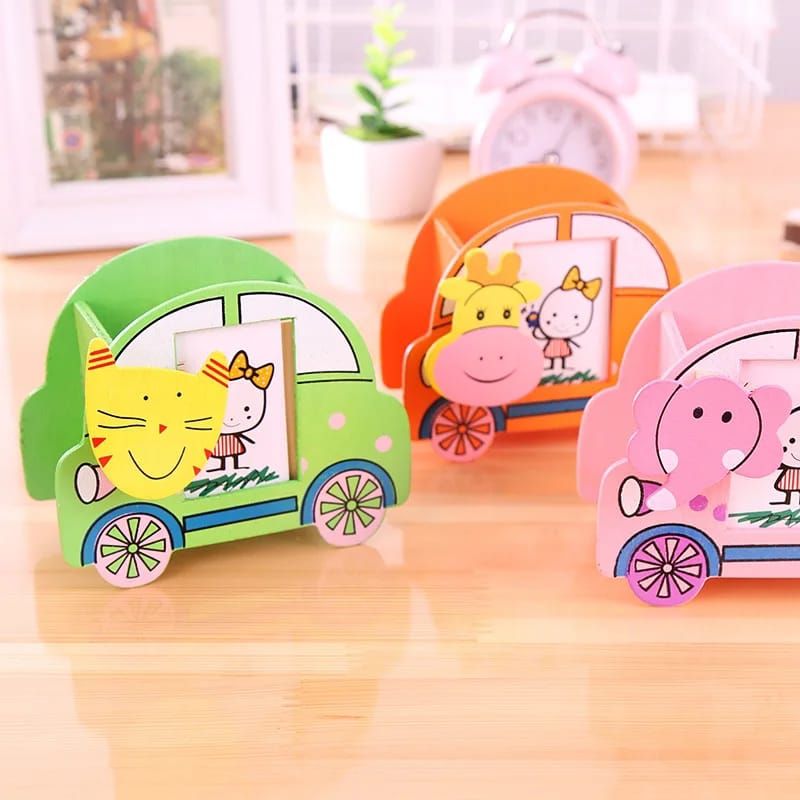 Wooden cartoon car shaped penholder. It is multi coloured with car design and photo slots for kids photos. It is light but durable and strong.