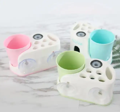 Toothbrush holder with toothpaste dispenser Wall-Mounted Toothbrush Holder with Toothpaste Dispenser &  Cup(s) Assorted - Bathroom Organizer Set