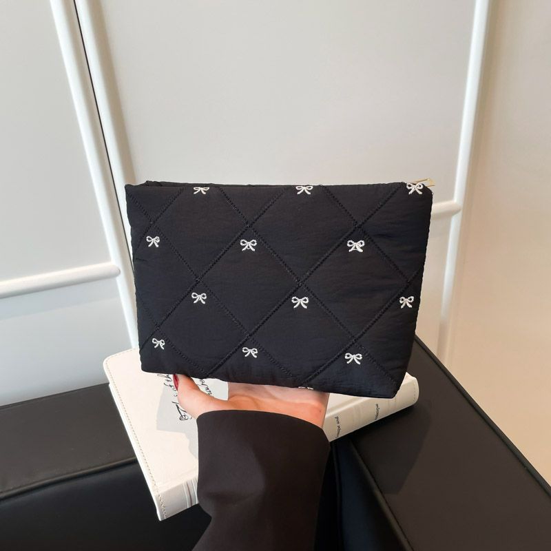 Butterfly knot pattern is fashionable and versatile. Quilted embroidery thread grid filled cotton makeup bag, casual hand-held bag, warm down small bag, inner bag, wash bag, pen bag, travel bag