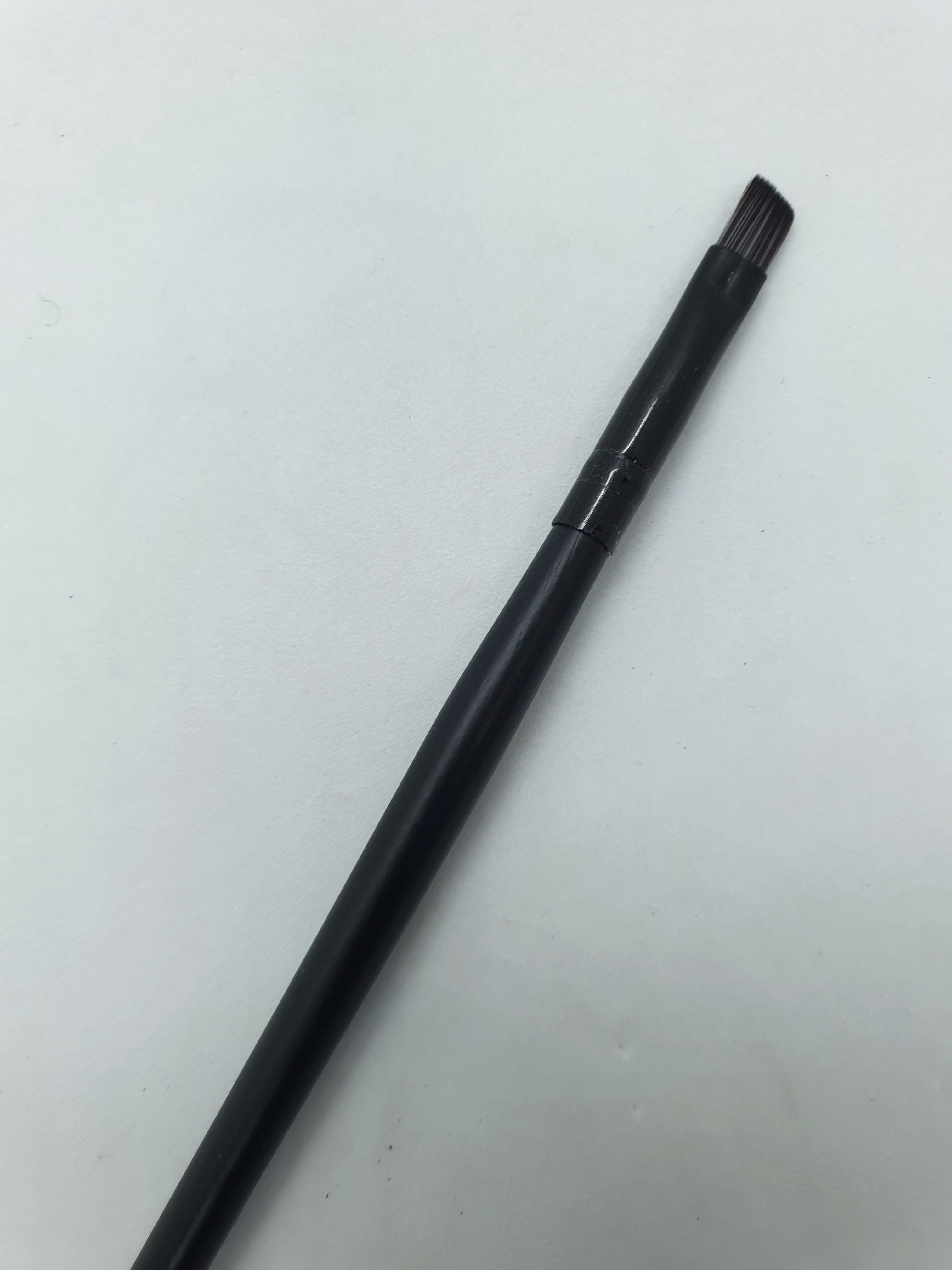 small thin-tipped brush, makeup brush designed for precision application for eyebrows and lip liner brush