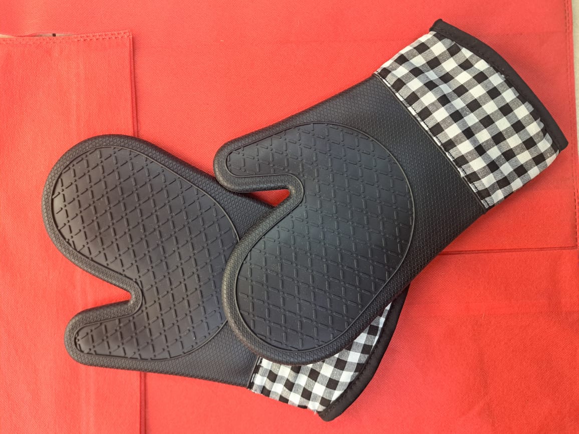 silicone oven mitts. 
These are protective gloves designed for handling hot items in the kitchen, such as baking trays, pots, and pans from ovens, stovetops, or microwaves. 
Material: They feature a s