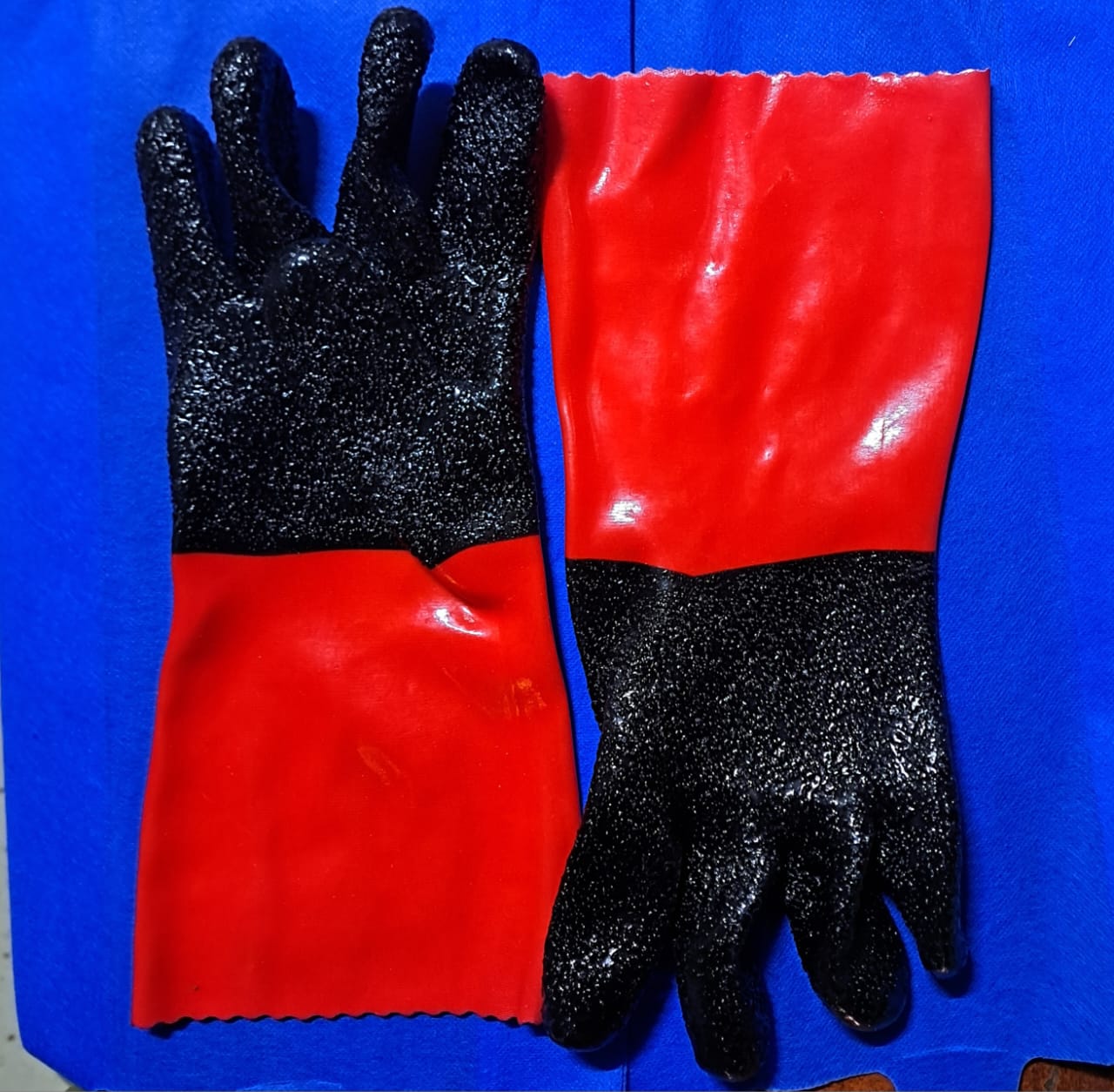 PVC Safety Gloves or Rubber Gloves. 
These gloves are designed for hand protection in various industrial and general-purpose applications, especially when dealing with oils, greases, and certain chemi