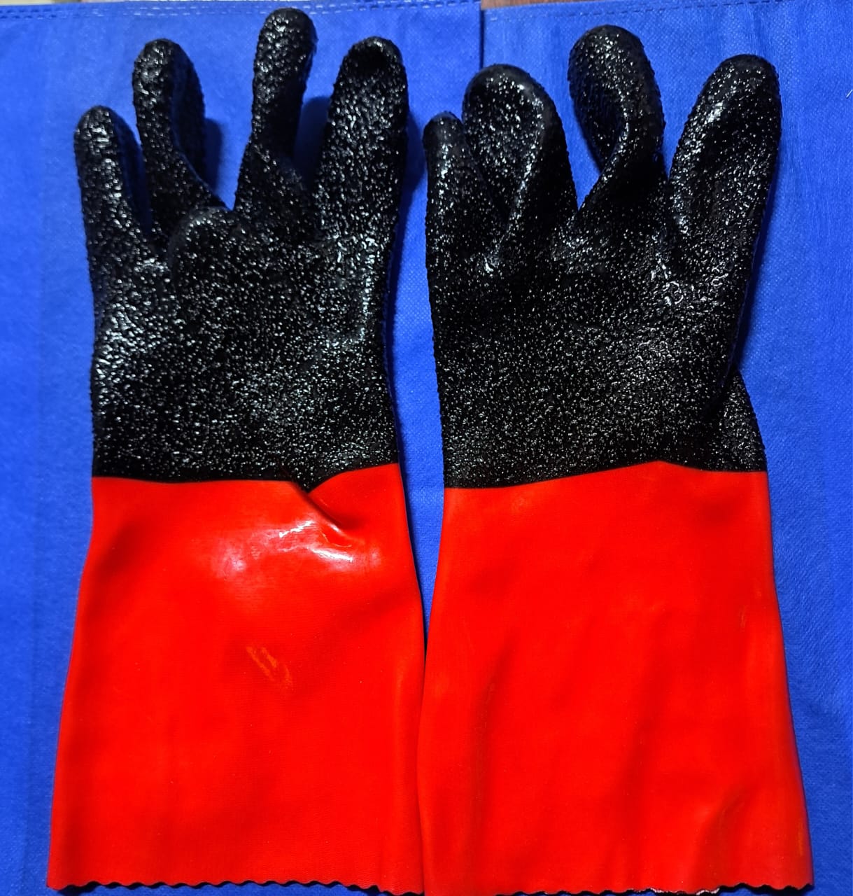 PVC Safety Gloves or Rubber Gloves. 
These gloves are designed for hand protection in various industrial and general-purpose applications, especially when dealing with oils, greases, and certain chemi