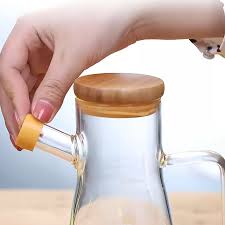 A 950ml oil jar is an essential kitchen accessory designed for convenient storage and precise pouring of cooking oils. Crafted from high-quality, food-grade materials such as thickened glass, stainles