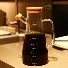 A 950ml oil jar is an essential kitchen accessory designed for convenient storage and precise pouring of cooking oils. Crafted from high-quality, food-grade materials such as thickened glass, stainles