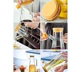 A 950ml oil jar is an essential kitchen accessory designed for convenient storage and precise pouring of cooking oils. Crafted from high-quality, food-grade materials such as thickened glass, stainles