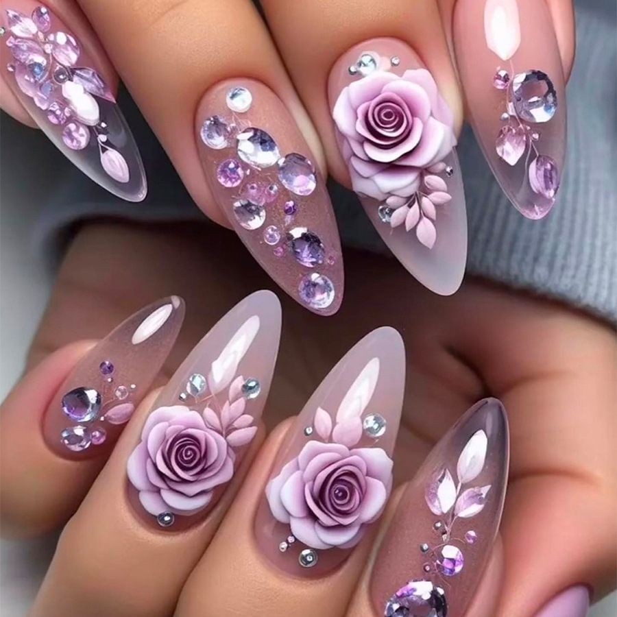 Almond-shaped handcrafted wearable nail tips with a high-end purple rose rhinestone design for a beautiful manicure.