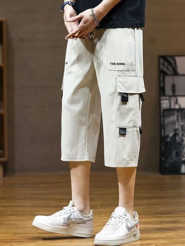 New summer sports overalls men's cropped trousers men's ice silk thin fashion pants casual shorts.