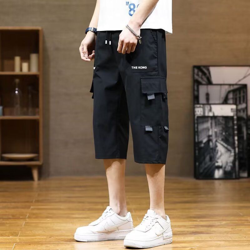 New summer sports overalls men's cropped trousers men's ice silk thin fashion pants casual shorts.