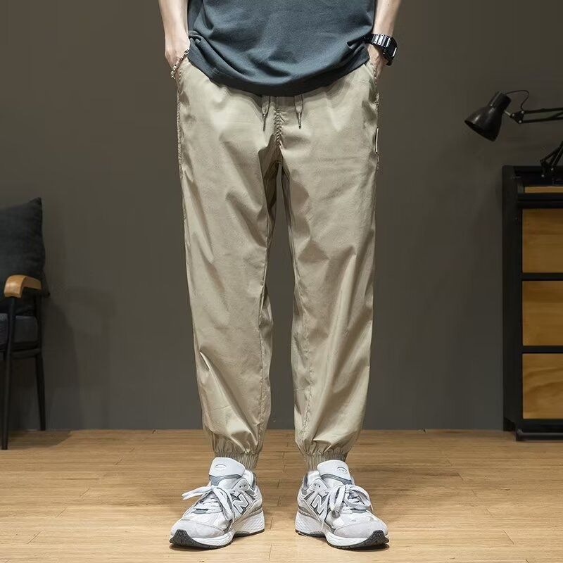 The new men's overalls in summer are simple and elastic, and the waist is fast-drying sweatpants. The tide brand is loose, and the feet are tied with ice silk casual pants