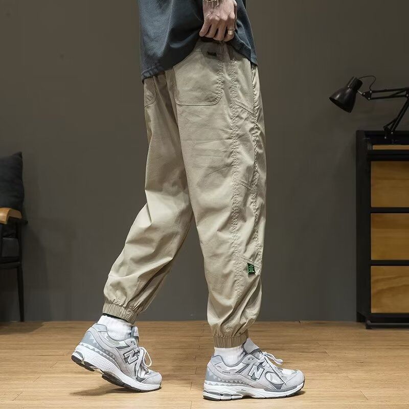 The new men's overalls in summer are simple and elastic, and the waist is fast-drying sweatpants. The tide brand is loose, and the feet are tied with ice silk casual pants