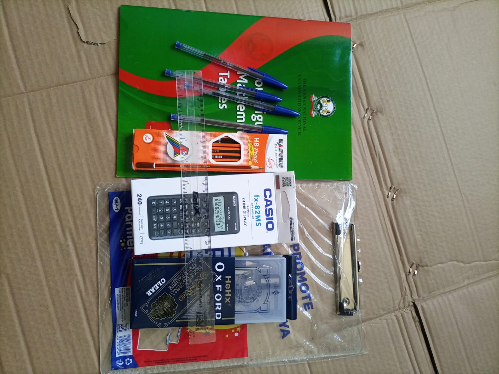 CALCULATOR + +transparent set+12 pencis+ 2rubbers+ruller +4BIC biro pens+ log table +transparent clipboard